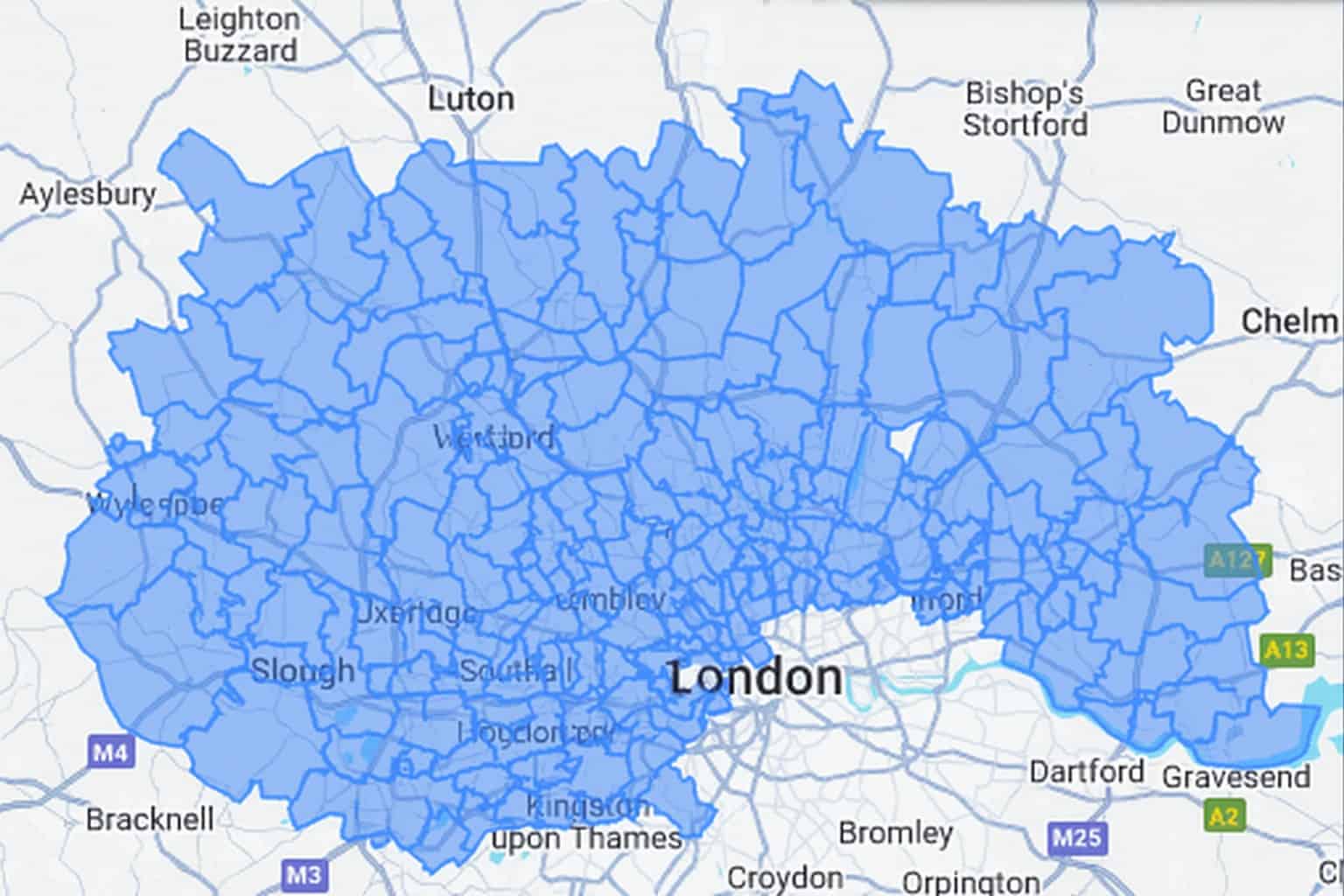 A map showing Greater London and surrounding areas with the London area highlighted in blue overlay. Major towns and motorways are labeled.